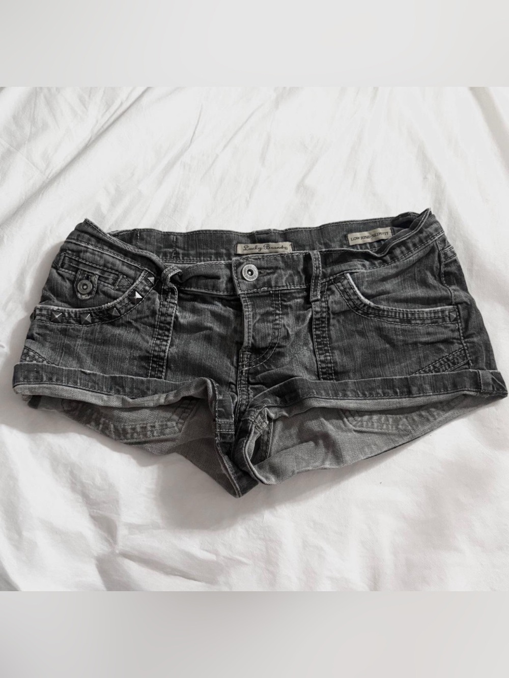 Avant Garde style grey studded mini shorts